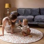 mum and baby playtime on round elegant Morris play mat from totter and tumble in stylish living room