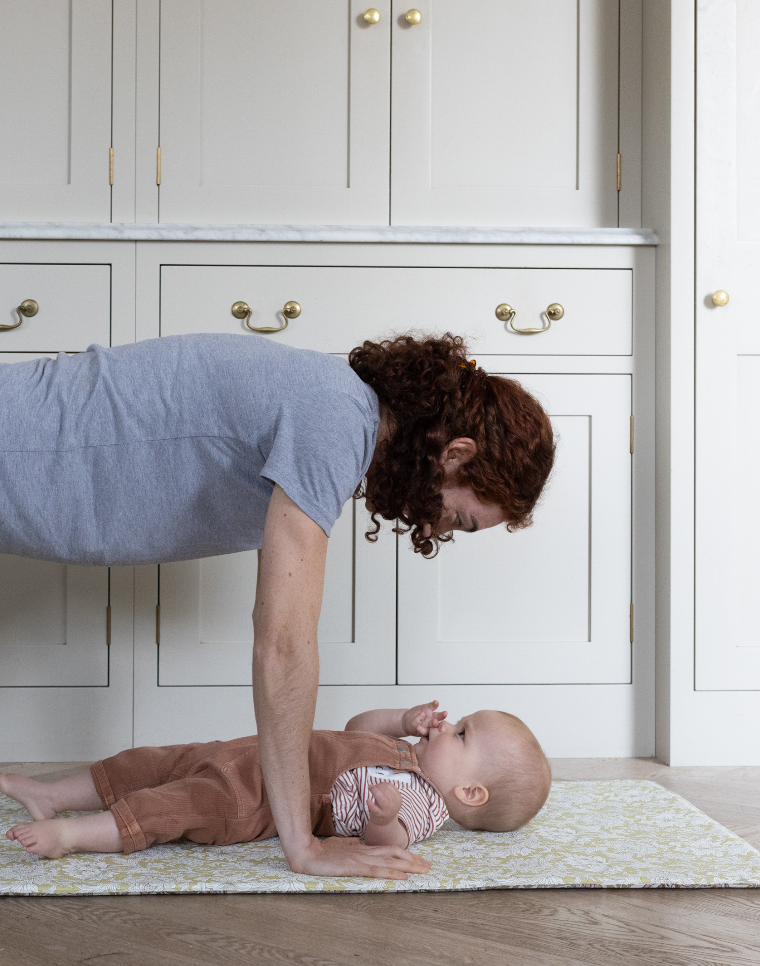 totter and tumble playmats are mutlfunctional play mats that can be used by mom and baby. Mother exercising with baby yoya playing together, foam play mat provides support and safe place for your baby on the floor