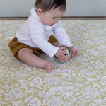 baby playing on padded play mat from totter and tumble comfortable and supportive area rug. waterproof playmat tapis de jeu, 