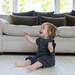 baby playing on Spielmatte. schuim and opgevuld speelkleed. totter and tumble play mats reversible double sided designs to suit your home style and interior whilst providing a non toxic play mat and play area for your baby or toddler to practise sitting