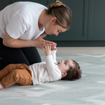 Mother and baby enjoying floor time on Thick memory foam mat for babies and adults designed for modern homes with artisan Ikat print in green and grey shades