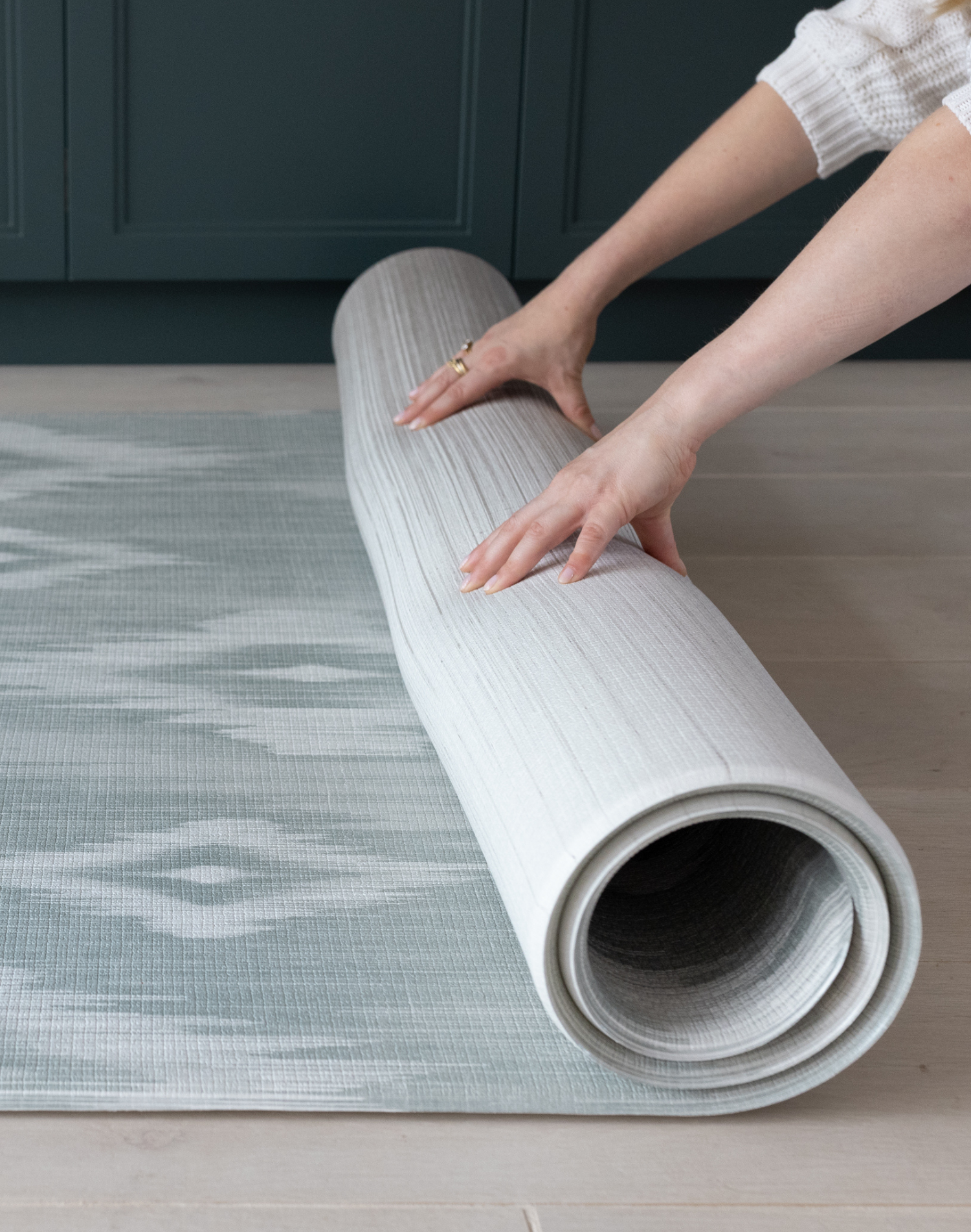 Rolling one piece Tumbling mats designed for safe floor play in a range of sizes and styles the Odissi is modern with a green and beige ikat design