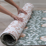 large soft playmat for kids being rolled out on the hard tiled floor