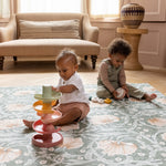 toddler and baby playing on large stylish green pimpernel playmat