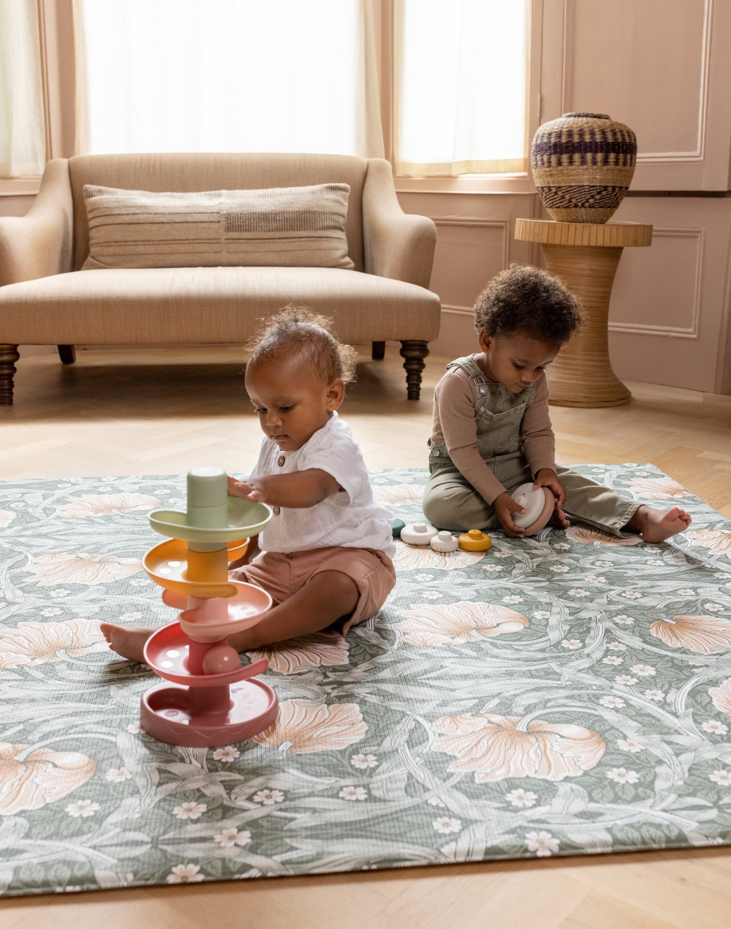 toddler and baby playing on large stylish green pimpernel playmat