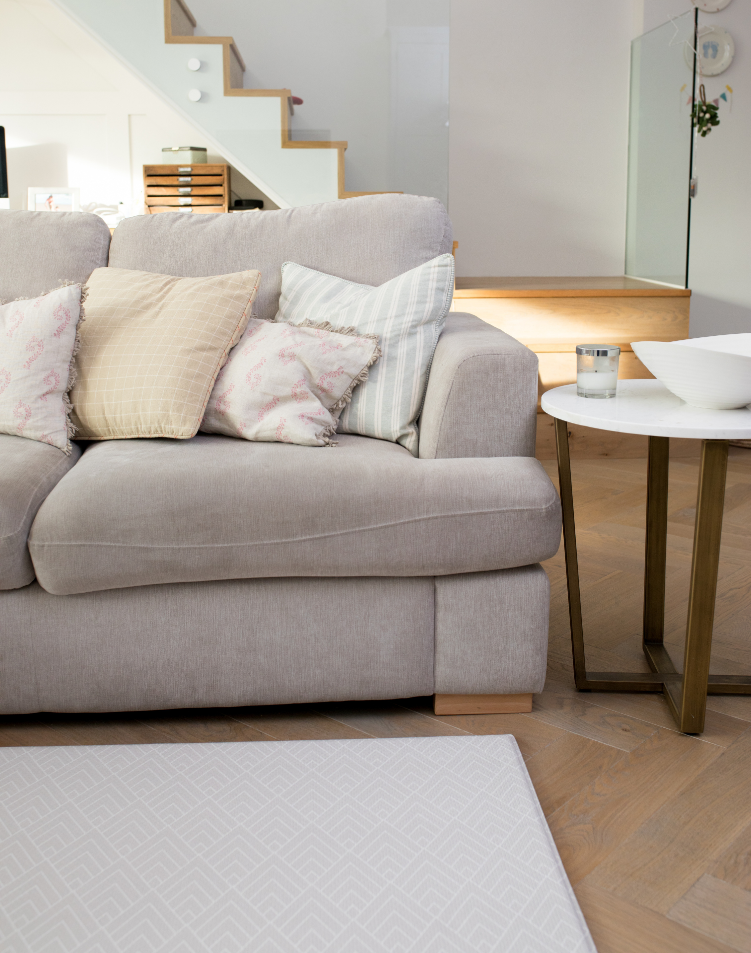 Neutral and modern family space with a chevron play mat that complements the gentle style of the room