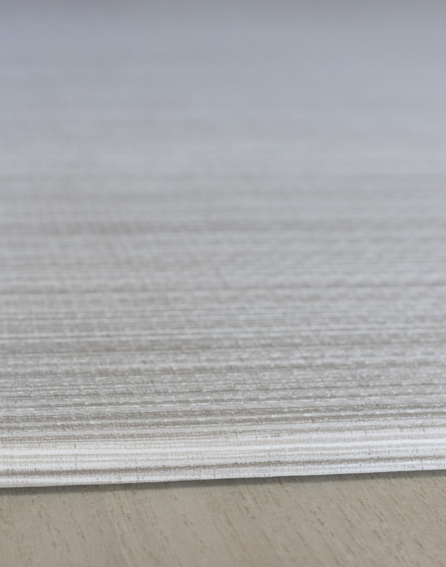 Close up of subtle gradient on the Tali Beige baby play mat made with memory foam 